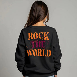 Woman facing back wearing a black sweatshirt that says Rock the World on the back