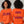 An orange crewneck sweatshirt shown on a model from both the front and back views. The front features the text 'START JUMPING' in a dark purple stylized font, while the back displays 'SHAKE THE STADIUM?' in a distressed purple font with a small gold accent in the middle word.