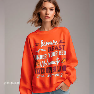 Person wearing a sweatshirt with 'Virginia Tech Football Game Day' design on a plain background
