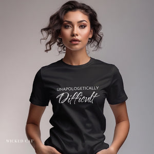 Woman wearing a black t-shirt with 'UNAPOLOGETICALLY Difficult' text on a plain background