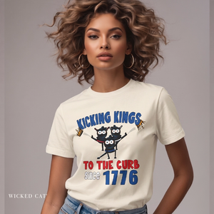 Woman wearing a white patriotic t-shirt with 'Kicking Kings to the curb since 1776' graphic and text.