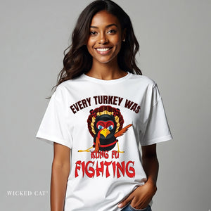 Woman wearing a white t-shirt with a turkey graphic and text, on a gray background