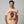 Man wearing a beige t-shirt with a graphic of a turkey and text on a gray background