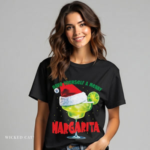Woman wearing a black t-shirt with a Christmas margarita graphic and text.