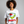 Woman wearing a white t-shirt with a festive margarita graphic and text.