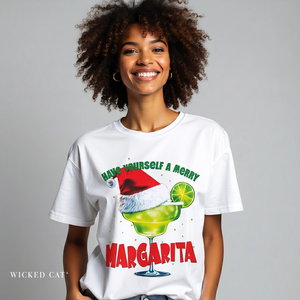 Woman wearing a white t-shirt with a festive margarita graphic and text.