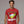 Man wearing a red t-shirt with a Christmas margarita graphic and text.