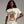 Model wearing a white t-shirt with 'Sleepy Hollow Enchanted Orchards' pumpkin design on a gray background