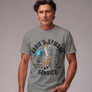 Man wearing grey t-shirt with logo graphic and text 'Eddie's Sewage Service You Dump We Pump Since 1989'.