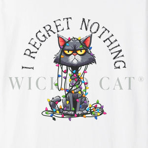 Close up of a white t-shirt with a cartoon cat tangled in Christmas lights with text at the top that says I Regret Nothing