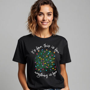 woman wearing a black t-shirt with a graphic of a tangled ball of lights with text It's fine, this is fine, everything is fine.