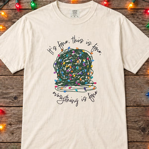 ivory  t-shirt with a graphic of a tangled ball of lights with text It's fine, this is fine, everything is fine.