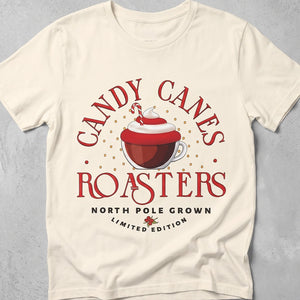 Ivory t-shirt with graphic of a festive coffee mug and text Candy Canes Roasters North Pole Grown Limited Edition