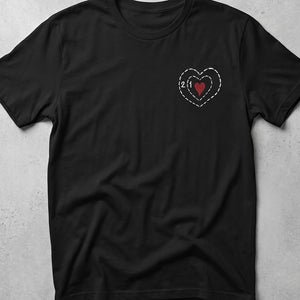 Black t-shirt with embroidered grinch heart design