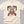 Ivory t-shirt with festive holiday graphic for Mama Claus Premium Holiday Spirits Moonshine Distillery