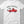 White t-shirt with Merry Christmas and graphic of a red truck and Charlie Brown Tree in the back