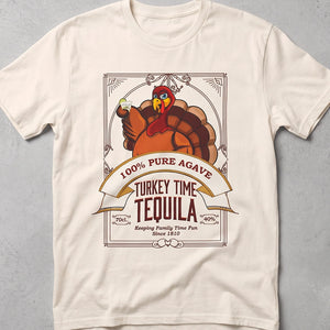 Ivory t-shirt with Holiday graphic of a tequila label, turkey holding a shot of tequila and text 'Turkey Time Tequila Keeping Family Time Fun Since 1810'