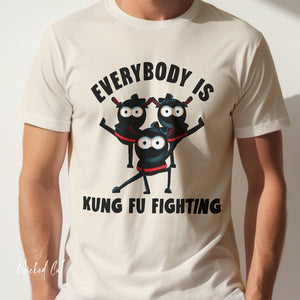 White t-shirt with cartoon characters and text 'Everybody is Kung Fu Fighting' on a plain background