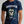 Person wearing a dark gray t-shirt with 'Tequila Lovers Sugar Skull' design on a plain background