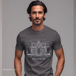 Man wearing a gray t-shirt with a car blueprint design on a gray background