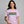 An lilac short-sleeve crewneck t-shirt featuring a distressed green 'ELM STREET' sign graphic printed across the chest.