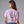 A woman shown from the back wearing a light lavender-purple t-shirt with black hand-drawn text on the back reading 'ONE TWO FREDDYS COMING FOR YOU