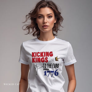 Woman wearing a white patriotic t-shirt with a graphic and text King Kings to the Curb since 1776 on a gray background