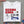 White t-shirt with 'Kicking Kings to the Curb since 1776' text and graphics on a gray surface.