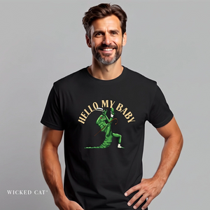 A man wearing a black graphic t-shirt with a green cartoon character and the text 'HELLO MY BABY' in gold. The brand name 'WICKED CAT' is visible in the bottom-left corner against a solid gray background.