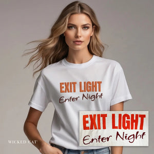Woman wearing a white t-shirt with 'EXIT LIGHT Enter Night' text, holding a sign matching the text.