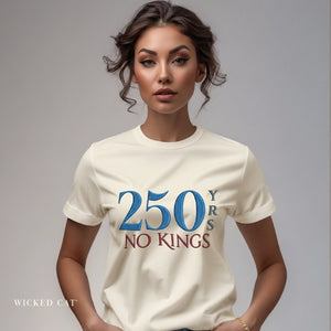 Woman wearing a white t-shirt with '250 YRS NO KINGS' text on a gray background