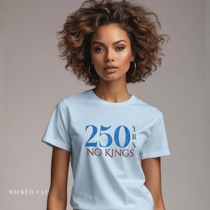 Woman wearing a light blue t-shirt with '250 Yrs No Kings' text on a plain background