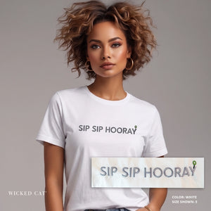 Woman wearing a white t-shirt with 'SIP Sip Hooray' text, against a plain background.