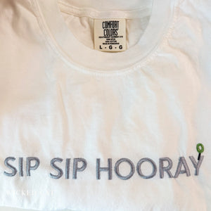 White shirt with 'SIP SIP HOORAY' text and Comfort Colors label.