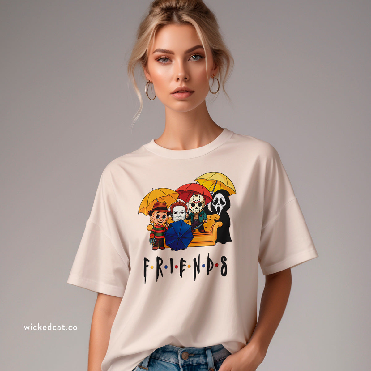 Beige t-shirt with 'Friends' graphic featuring horror movie characters with umbrellas on a white background