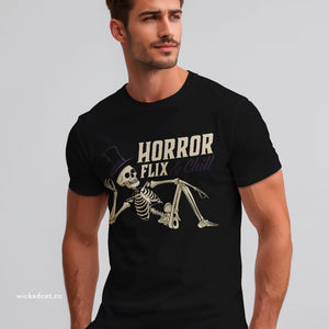 Person wearing a Boysenberry t-shirt with 'Horror Flix & Chill Skeleton Halloween' design on a plain background