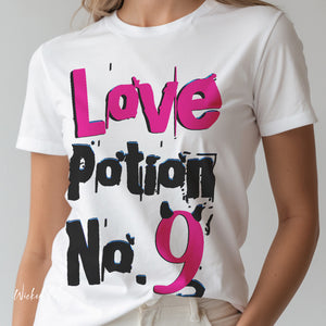 Person wearing a Athletic Heather t-shirt with 'Love Potion No 9 Witchy Woman' design on a plain background