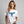 Woman wearing a white t-shirt with a blue moose graphic on a gray background