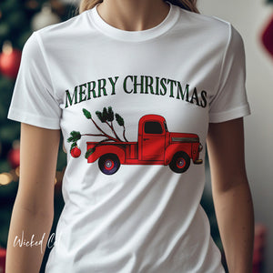White t-shirt with a red truck and 'Merry Christmas' design, worn by a person.