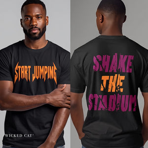 A man modeling a black graphic T-shirt shown from both front and back. The front has orange gothic-style text reading 'START JUMPING,' and the back has large distressed text reading 'SHAKE THE STADIUM' in purple and orange.