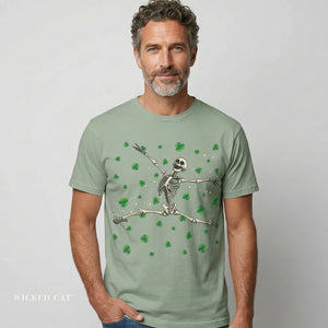 Man wearing a light green t-shirt with a skeleton design on a plain background