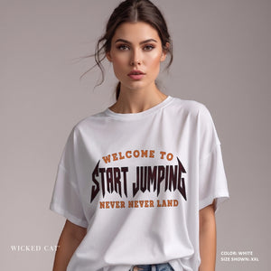 women wearing white t-shirt with Welcome to Never Never Land Start Jumping text on the front.