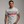 Man wearing a t-shirt with 'Vote Alien Invasion 2028' text on a plain background