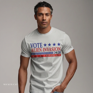 Man wearing a t-shirt with 'Vote Alien Invasion 2028' text on a plain background
