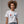 Person wearing a dark gray t-shirt with 'Red White and Fabulous Patriotic Martini July 4th' design on a plain background