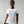 Person wearing a black t-shirt with 'Martini American Patriotic July 4th' design on a plain background