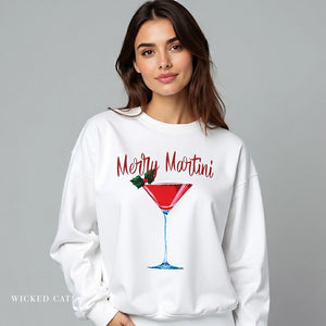Woman wearing a white sweatshirt with 'Merry Martini' design on a gray background