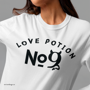 Person wearing a blue sweatshirt with 'Love Potion No 9 Halloween' design on a plain background