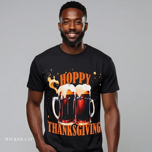 Man wearing a black t-shirt with 'Hoppy Thanksgiving' design on a gray background