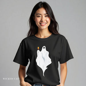 Person wearing a black t-shirt with a ghost holding a glass of champagne